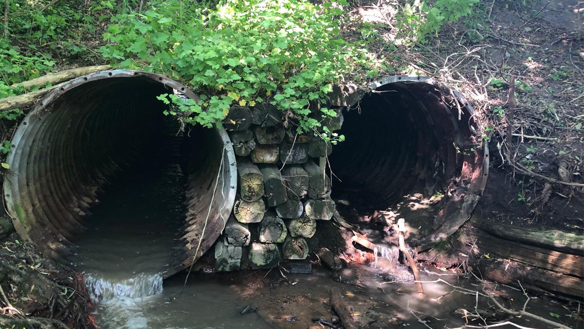 Twin steel pipe culverts