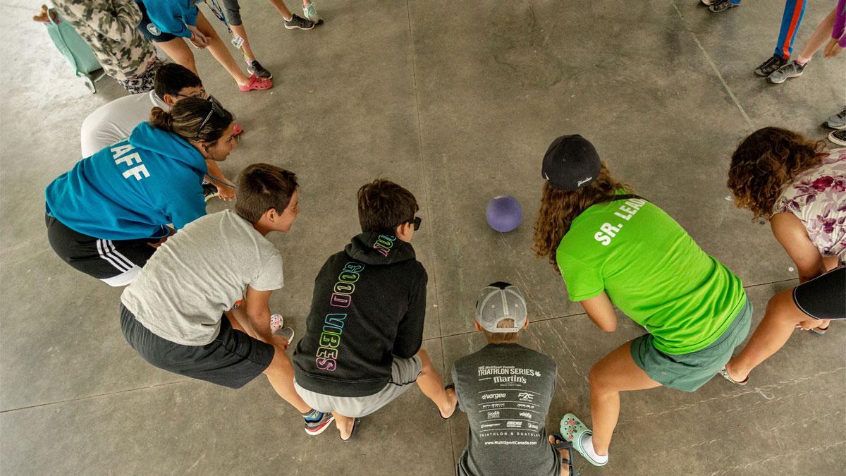 youth playing with ball, viewed from above