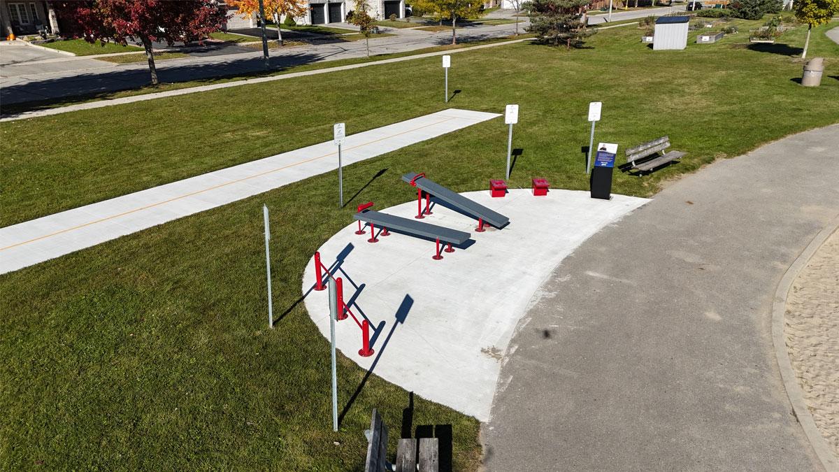 Fitness circuit including a push-up station, sit-up and curl-up benches, reach test box and shuttle run