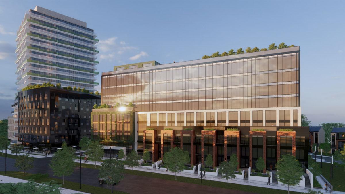 Modern buildings with glass facades and rooftop greenery.